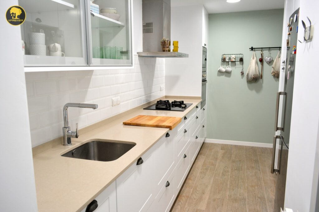 a kitchen with white cabinets and white countertops