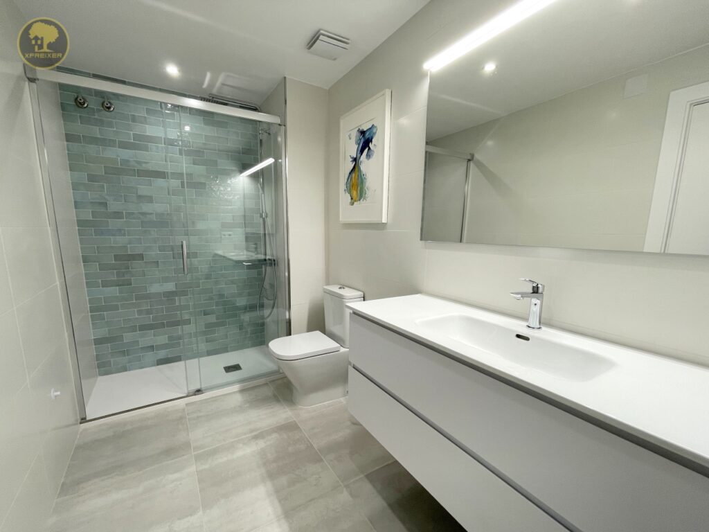 a bathroom with a shower and sink