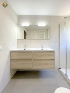 a bathroom with a mirror and sink