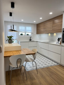 Blog 3 a kitchen with a table and chairs