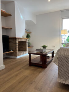 a living room with a fireplace and a couch