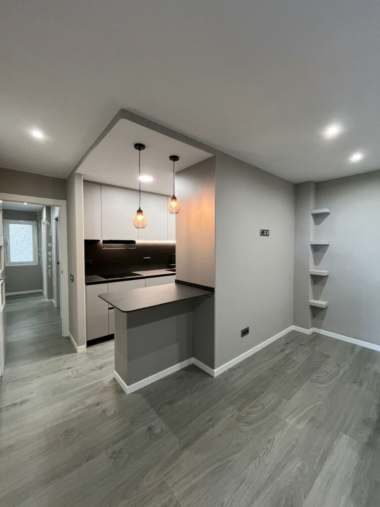 a kitchen with a wood floor and a wood floor