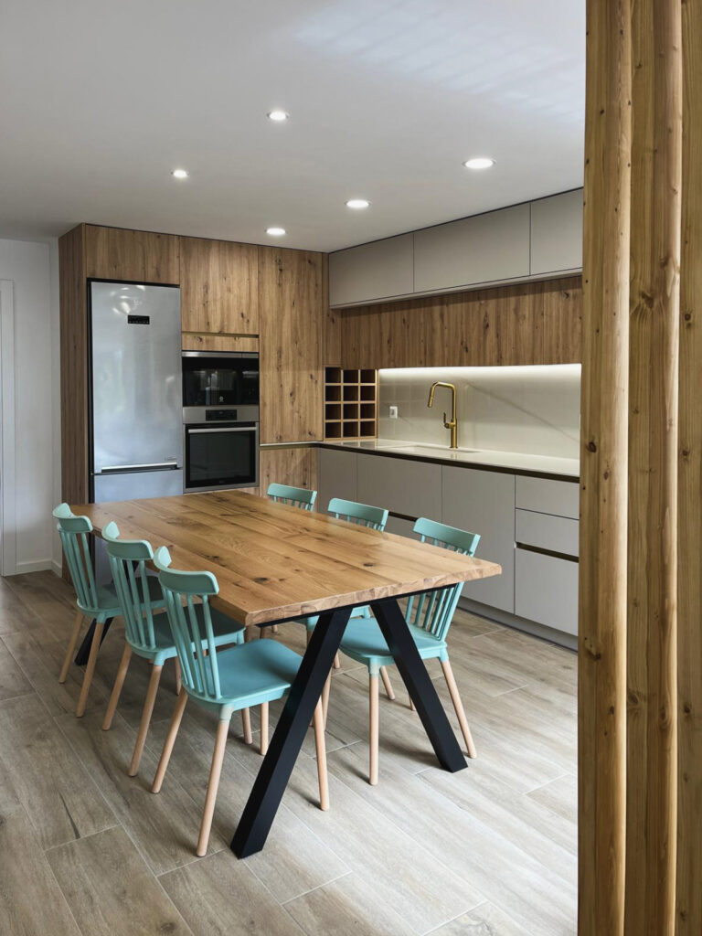 a kitchen with a table and chairs