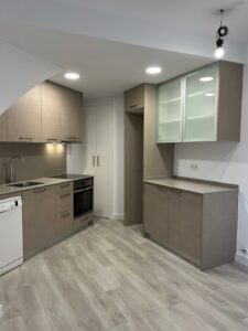 a kitchen with a sink and cabinets