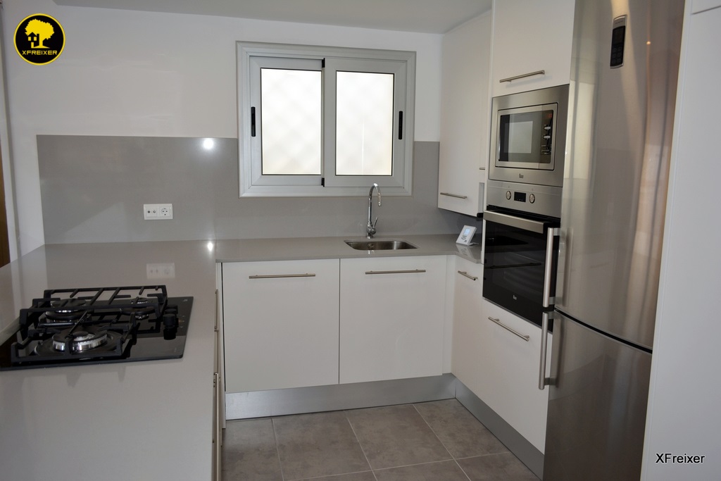 a kitchen with a sink and a window