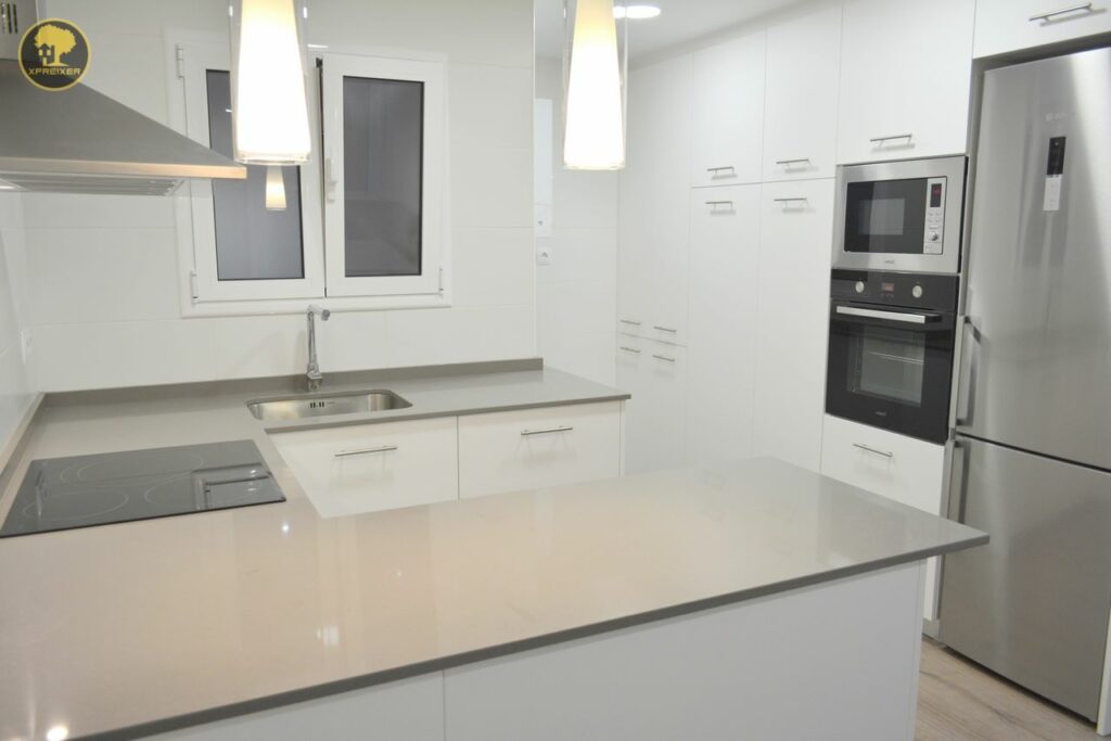 a kitchen with white cabinets and a sink